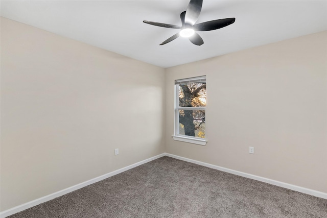 empty room with ceiling fan and carpet floors