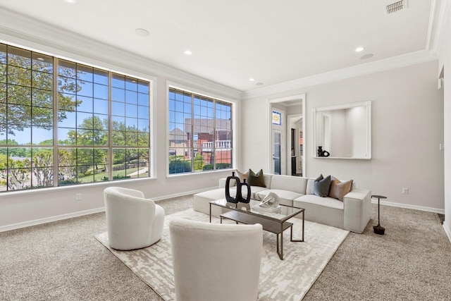 carpeted living area with baseboards, ornamental molding, visible vents, and recessed lighting