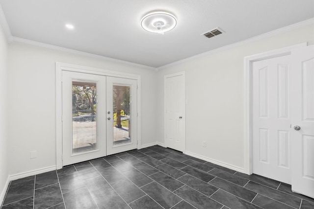 spare room with ornamental molding and french doors