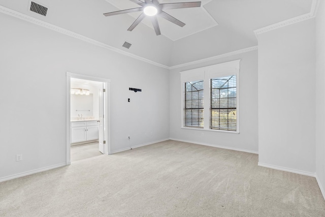 unfurnished bedroom featuring light carpet, ensuite bath, ceiling fan, and sink