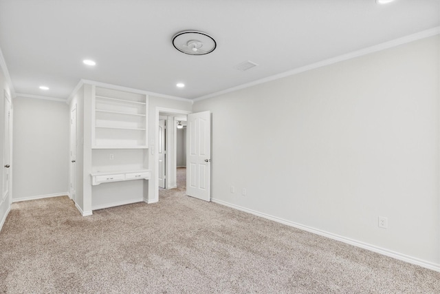 unfurnished bedroom featuring crown molding and light carpet