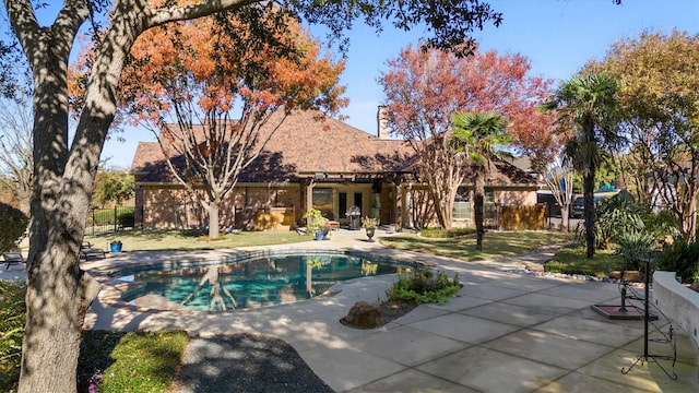 pool featuring a patio, french doors, and fence