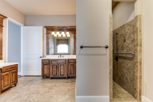 bathroom with vanity and tiled shower