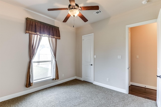 unfurnished bedroom featuring carpet and ceiling fan