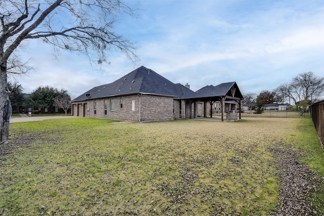 view of side of home featuring a lawn