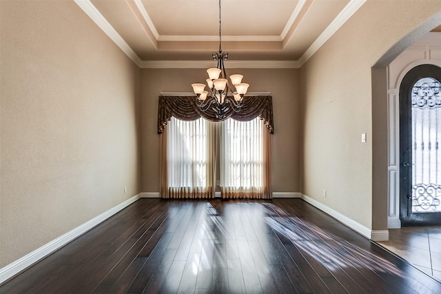 interior space featuring a healthy amount of sunlight, dark hardwood / wood-style flooring, and an inviting chandelier