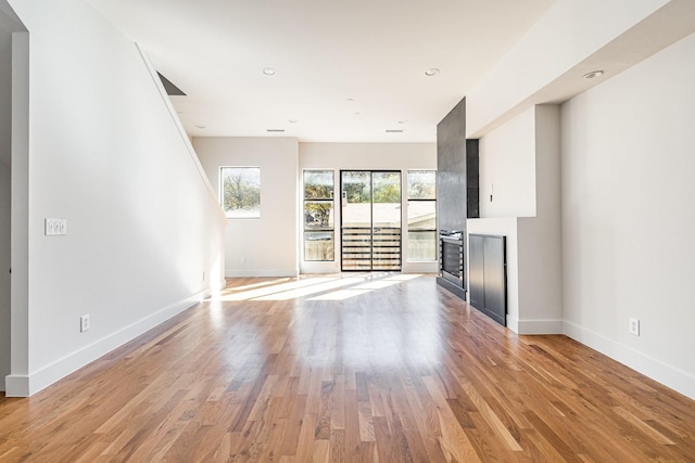 unfurnished living room featuring light hardwood / wood-style flooring