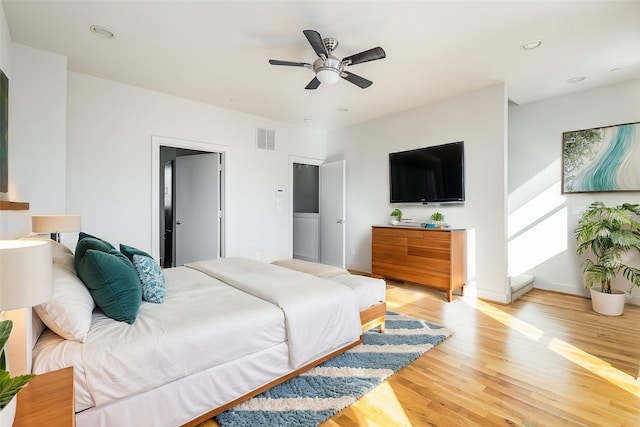 bedroom featuring light hardwood / wood-style floors and ceiling fan