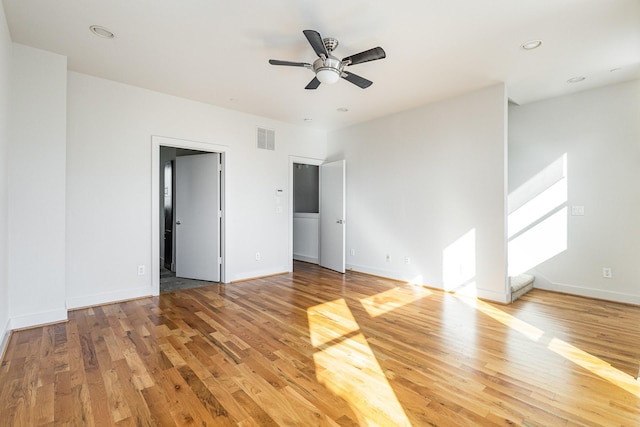 unfurnished bedroom with ceiling fan and hardwood / wood-style flooring