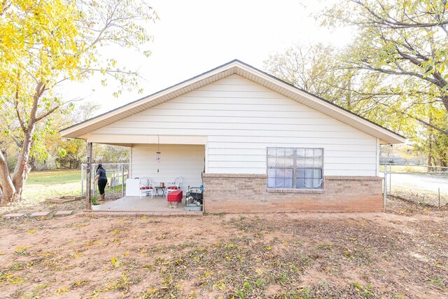 rear view of house featuring a patio