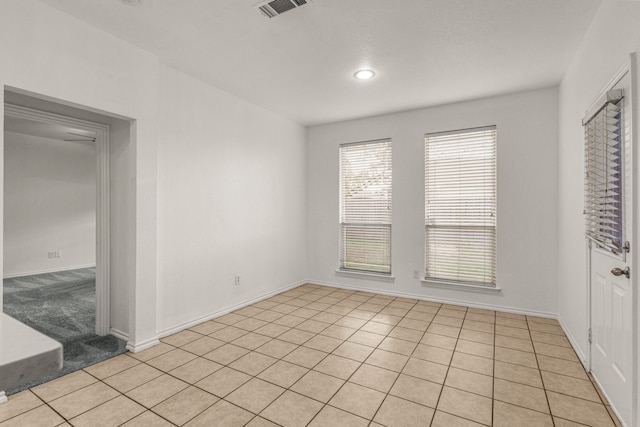 empty room featuring light tile patterned floors