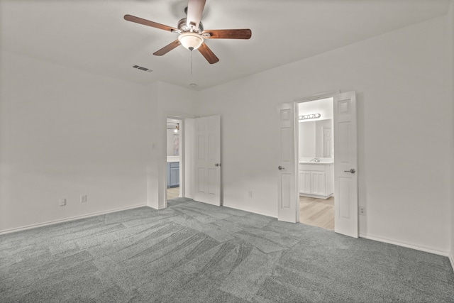 interior space featuring ceiling fan and light carpet