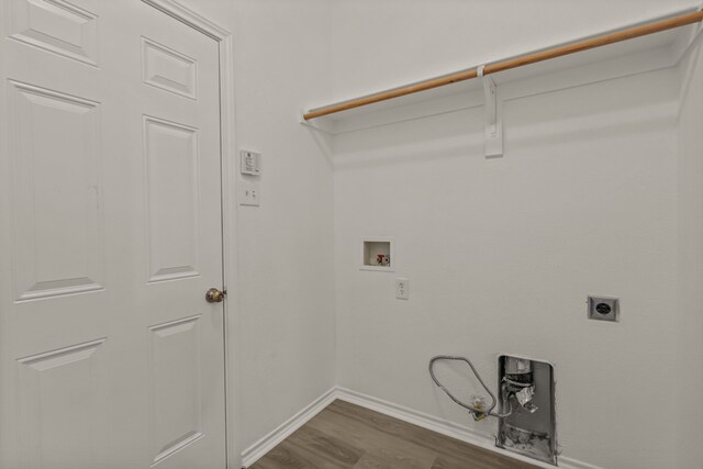 laundry room with hookup for a washing machine, electric dryer hookup, and wood-type flooring