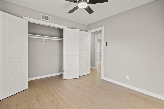 unfurnished bedroom with a closet, light hardwood / wood-style floors, and ceiling fan