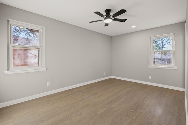 unfurnished room featuring ceiling fan and wood-type flooring