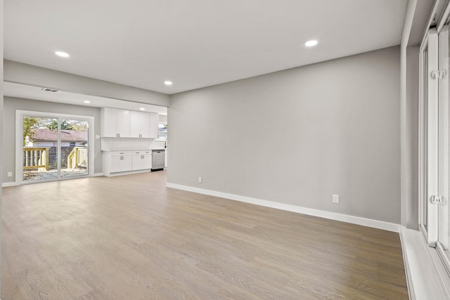 unfurnished living room featuring light hardwood / wood-style flooring