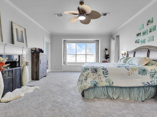 carpeted bedroom with ceiling fan and crown molding