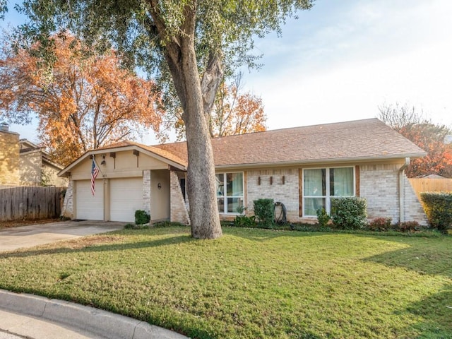 ranch-style home with a garage and a front yard