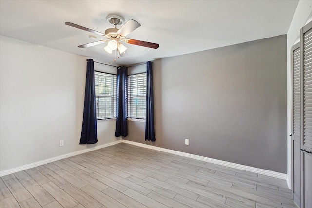 unfurnished room featuring light hardwood / wood-style flooring and ceiling fan