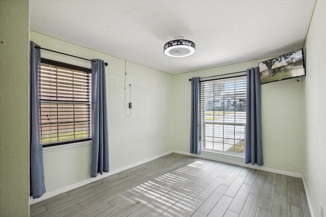 2100 Rockmoor Dr, Edgecliff Village, TX 76134 - spare room with wood tiled floors and healthy amount of natural light