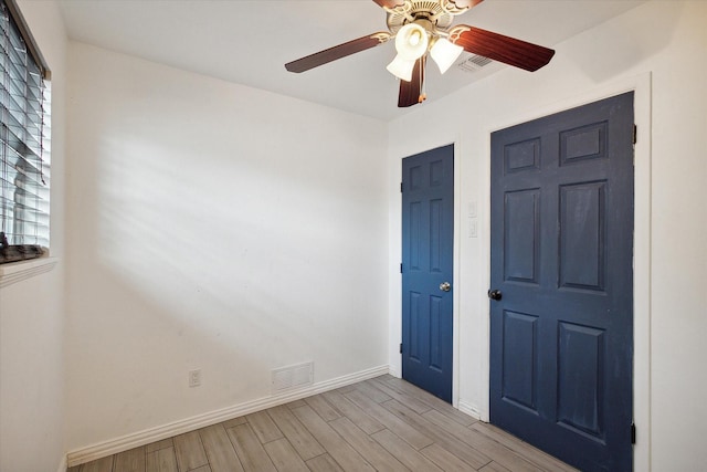 unfurnished bedroom featuring ceiling fan and light wood-type flooring