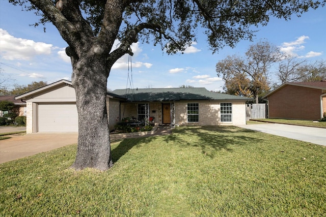 ranch-style house featuring a garage and a front yard