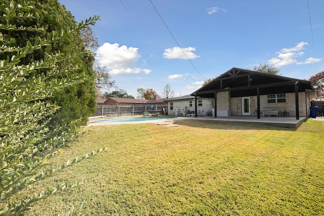 view of yard featuring a fenced in pool and a patio area