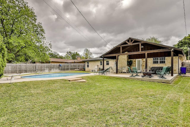 exterior space featuring a yard, a patio area, and a fire pit