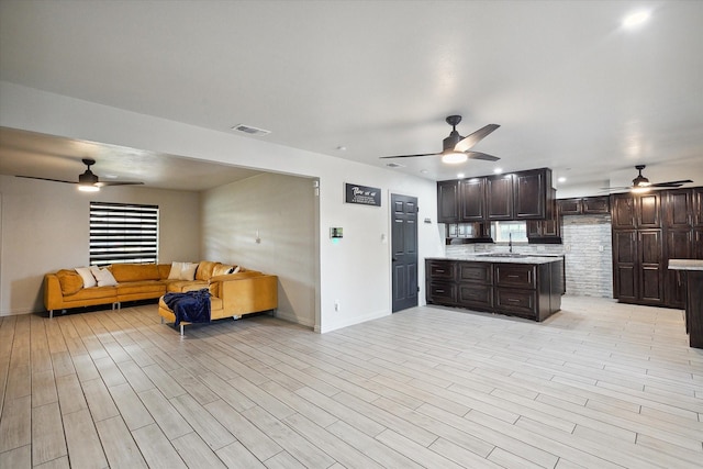 2100 Rockmoor Dr, Edgecliff Village, TX 76134 - kitchen with ceiling fan, open floor plan, and dark brown cabinets