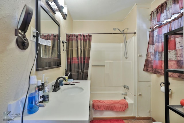 bathroom with shower / tub combo and vanity