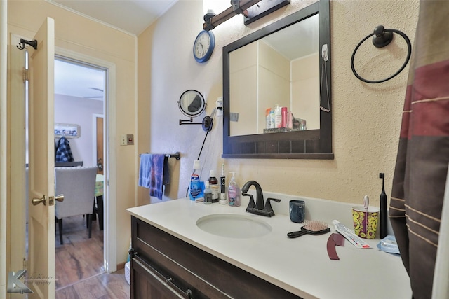 bathroom featuring hardwood / wood-style flooring and vanity