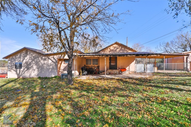 back of house featuring a yard