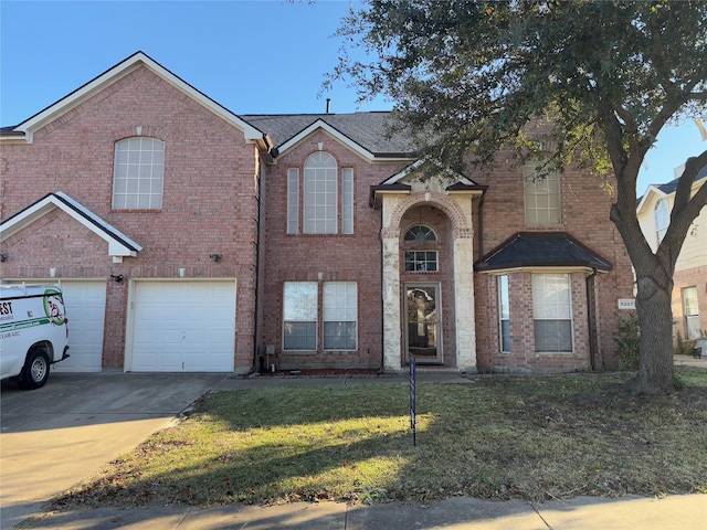 view of front of property featuring a garage and a front yard