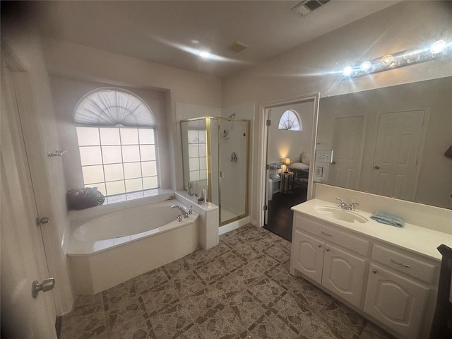 bathroom featuring vanity and shower with separate bathtub