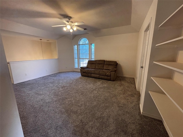 unfurnished room with ceiling fan and dark colored carpet