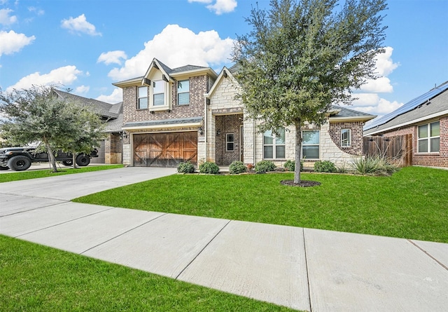 view of front facade featuring a garage and a front lawn