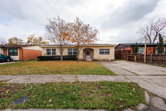 ranch-style home with a front yard