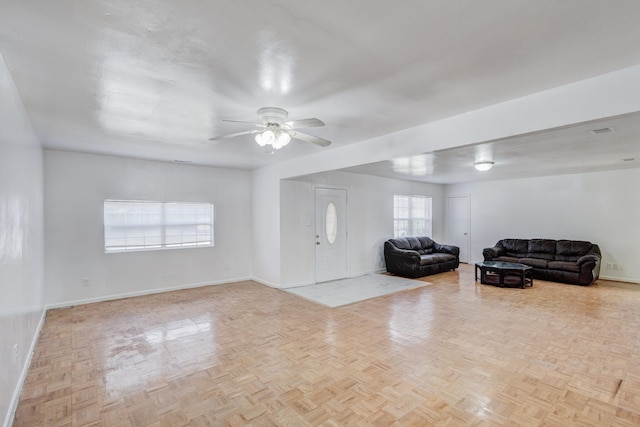 living room featuring ceiling fan and light parquet floors