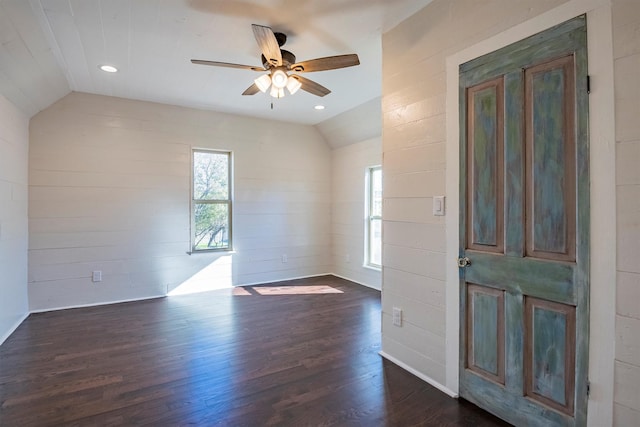 entrance foyer with dark hardwood / wood-style flooring, vaulted ceiling, and ceiling fan