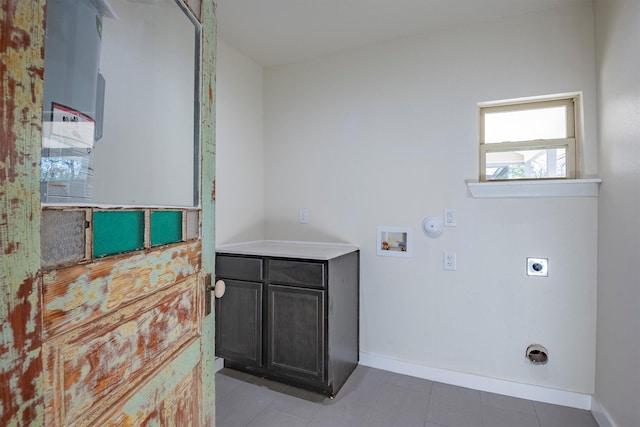 laundry room with tile patterned floors, hookup for a gas dryer, washer hookup, and hookup for an electric dryer