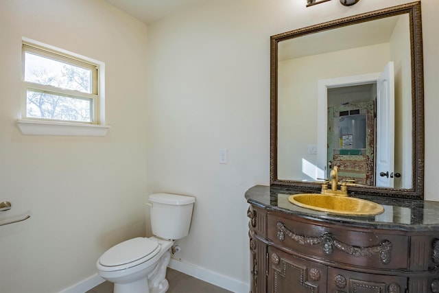 bathroom with tile patterned floors, vanity, and toilet