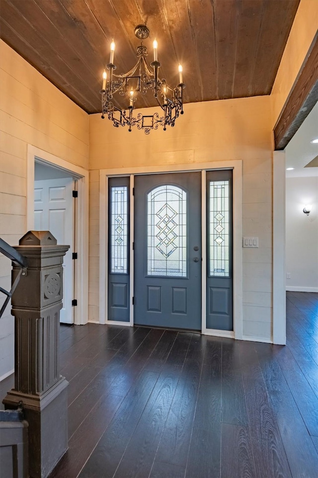 foyer featuring dark hardwood / wood-style flooring, a healthy amount of sunlight, and wood ceiling