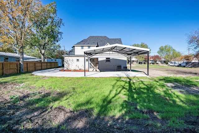 view of yard with a carport and a patio area