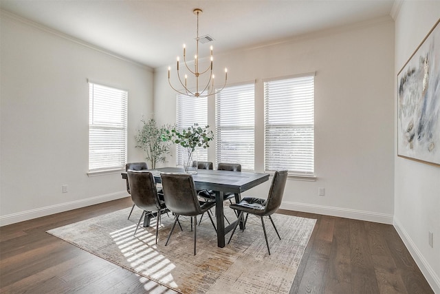 dining space with a chandelier, dark hardwood / wood-style floors, and ornamental molding