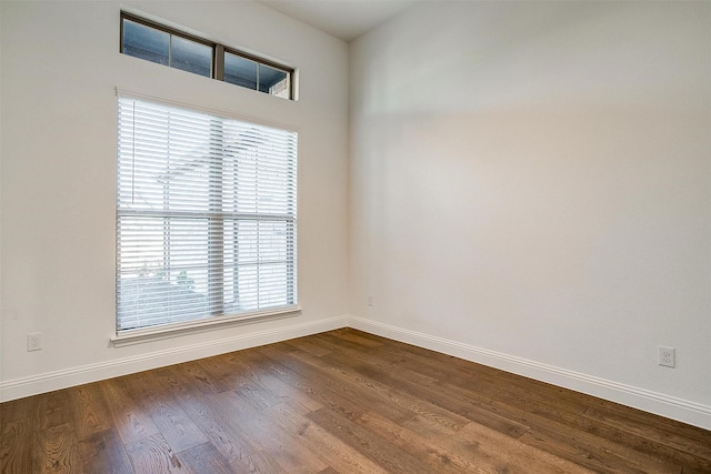 spare room with wood-type flooring