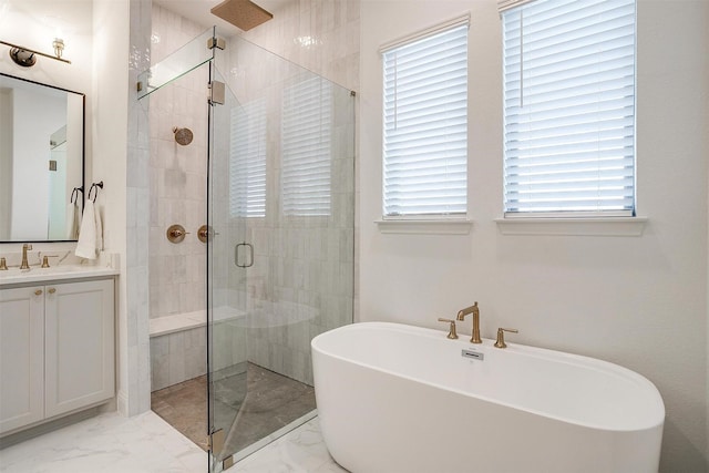 bathroom featuring plenty of natural light, vanity, and independent shower and bath