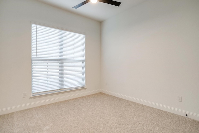 empty room with carpet and ceiling fan