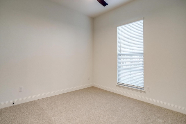 carpeted spare room with plenty of natural light