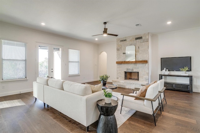 living room featuring french doors, dark hardwood / wood-style flooring, ceiling fan, and ornamental molding