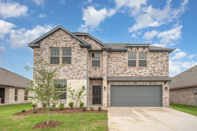 view of front of house featuring a garage and a front lawn